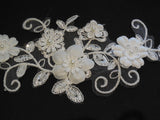 An ivory beaded floral lace applique / bridal wedding beaded floral tulle lace motif is for sale. Sold by per piece
