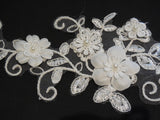 An ivory beaded floral lace applique / bridal wedding beaded floral tulle lace motif is for sale. Sold by per piece