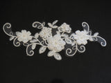 An ivory beaded floral lace applique / bridal wedding beaded floral tulle lace motif is for sale. Sold by per piece
