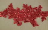 A red sequins floral lace applique red sequined lace motif approx. 24.5cm x 11cm is for sale. Sold by per piece.