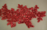 A red sequins floral lace applique red sequined lace motif approx. 24.5cm x 11cm is for sale. Sold by per piece.