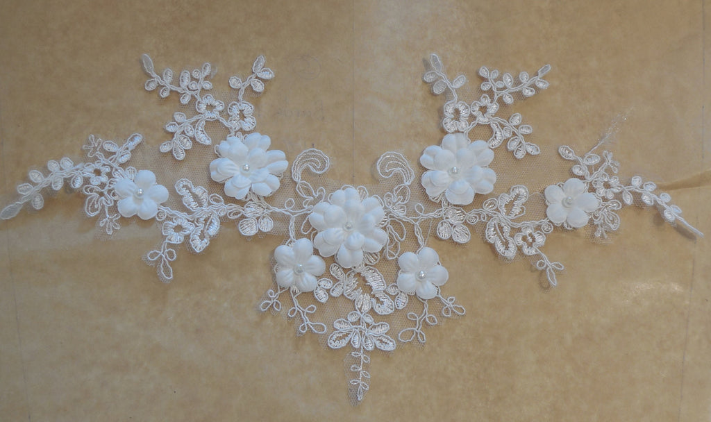 An ivory beaded floral lace applique bridal wedding floral tulle beads lace motif is for sale. Sold by per piece