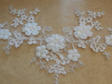An ivory beaded floral lace applique bridal wedding floral tulle beads lace motif is for sale. Sold by per piece