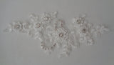 An ivory beaded rhinestones lace applique bridal wedding floral beads lace motif is for sale. Sold by per piece