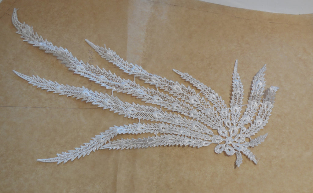 A black or off white bridal wedding peacock tail style lace applique / lace motif is for sale.  sold by per piece