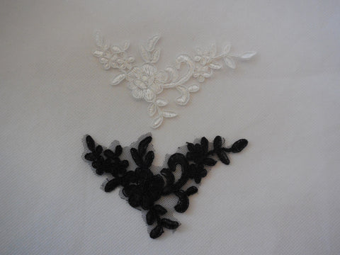 A Small piece of black or ivory lace applique / dress making floral lace motif