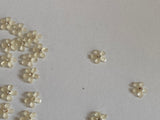 Craftuneed Bundle 91pcs Mini Acrylic Flower Embellishments Ivory 5-Petal Blossoms with Rhinestone Center for Crafts, Nail Art, DIY Projects