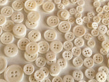 Craftuneed Bundle 145pcs sew on ivory shell plastic circle buttons 4 hole flat button