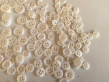 Craftuneed Bundle 145pcs sew on ivory shell plastic circle buttons 4 hole flat button