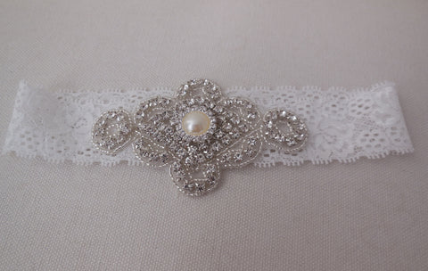 A Bridal wedding rhinestones applique beaded rhinestones motif applique on a elastic lace band is for sale. sold by per piece