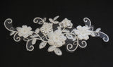 An ivory beaded floral lace applique / bridal wedding beaded floral tulle lace motif is for sale. Sold by per piece