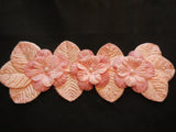 A peach pink beaded fabric floral motif / peach pink beaded floral applique is for sale. sold by per piece