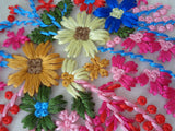 A piece of colourful cotton threads T-shirt motif floral cotton applique on tulle is for sale. Sold by per piece