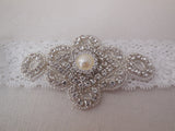 A Bridal wedding rhinestones applique beaded rhinestones motif applique on a elastic lace band is for sale. sold by per piece
