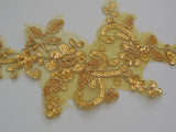 A gold sequined floral lace applique bridal wedding sequined tulle lace motif is for sale. sold by per piece