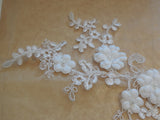An ivory beaded floral lace applique bridal wedding floral tulle beads lace motif is for sale. Sold by per piece