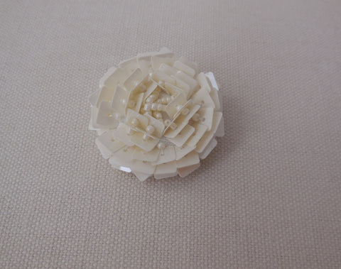 A jacket coat plastic ivory sew on floral button sequins beaded button 4.2X4.2cm is for sale. Sold by per button