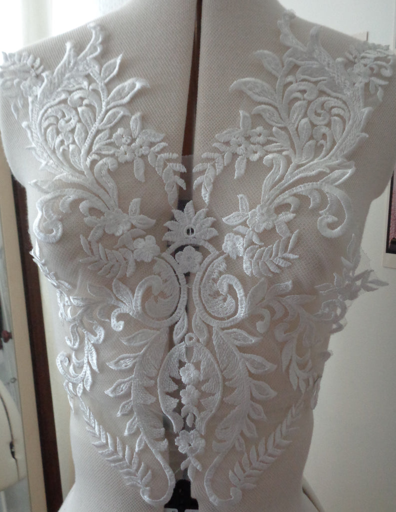 A piece of ivory sequined lace applique bridal wedding floral embroidered bolero lace motif is for sale. Sold by per piece