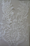 A piece of ivory sequined lace applique bridal wedding floral embroidered bolero lace motif is for sale. Sold by per piece