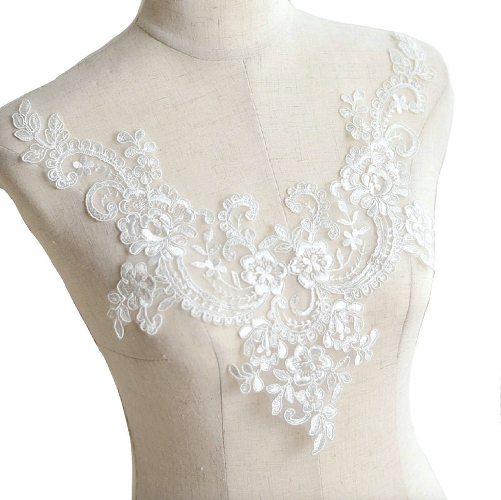 An ivory embroidered lace collar applique floral neckline collar tulle lace motif is for sale. Sold by per piece.
