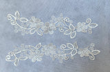 A pair of ivory or black embroidered lace applique floral lace motif patch for dress making sewing UK seller.